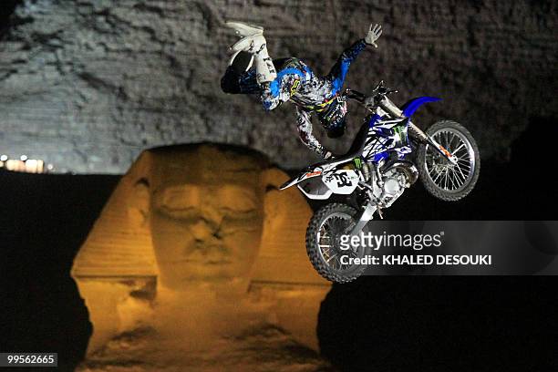 Freestyle biker jumps in front of the Sphinx and the Giza pyramids during the second stage of the freestyle motocross Red Bull X-Fighters World Tour...