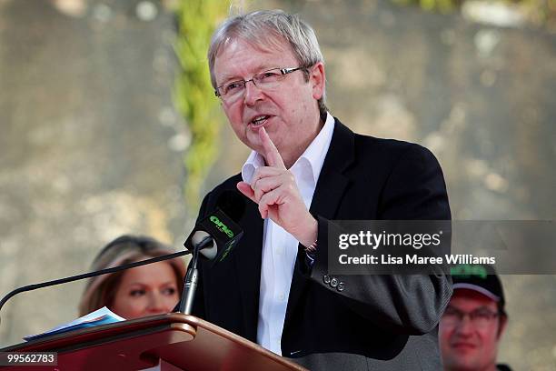 Prime Minister Kevin Rudd greets the crowd after the arrival of teen sailor Jessica Watson following her world record attempt to become the youngest...