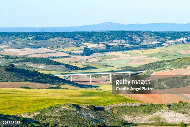 spring landscape with railway and a bridge - miguelangelortega stock pictures, royalty-free photos & images