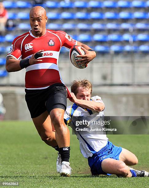 Alisi Tupuailei of Japan is tackled during the HSBC Asian 5 Nations match between Japan and Kazakhstan at Prince Chichibu Stadium on May 15, 2010 in...