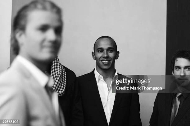 Lewis Hamilton of Great Britain and McLaren Mercedes models at the Amber Fashion Show and Auction held at the Meridien Beach Plaza on May 14, 2010 in...
