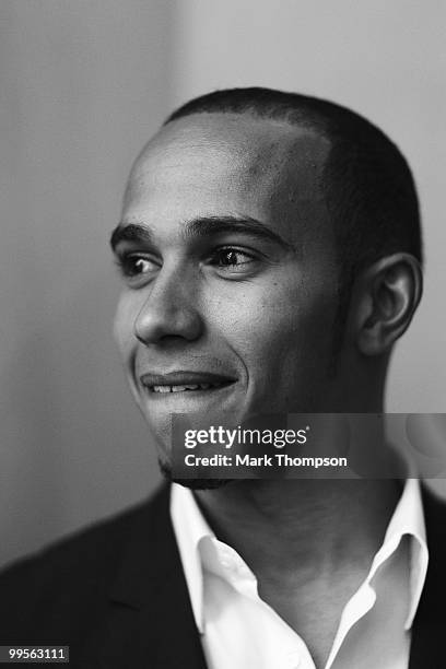 Lewis Hamilton of Great Britain and McLaren Mercedes models at the Amber Fashion Show and Auction held at the Meridien Beach Plaza on May 14, 2010 in...