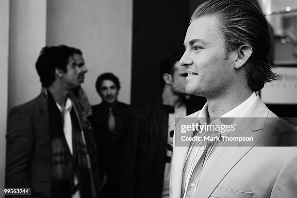 Nico Rosberg of Germany and Mercedes GP models at the Amber Fashion Show and Auction held at the Meridien Beach Plaza on May 14, 2010 in Monte Carlo,...