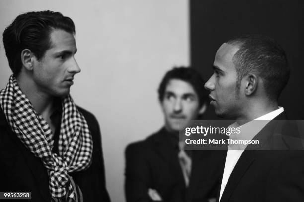 Adrian Sutil of Germany and Force India and Lewis Hamilton of Great Britain and McLaren Mercedes model at the Amber Fashion Show and Auction held at...