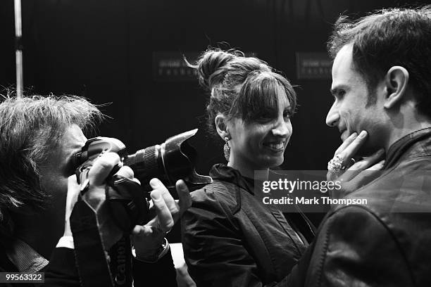 Vitantonio Liuzzi of Italy and Force India models at the Amber Fashion Show and Auction held at the Meridien Beach Plaza on May 14, 2010 in Monte...