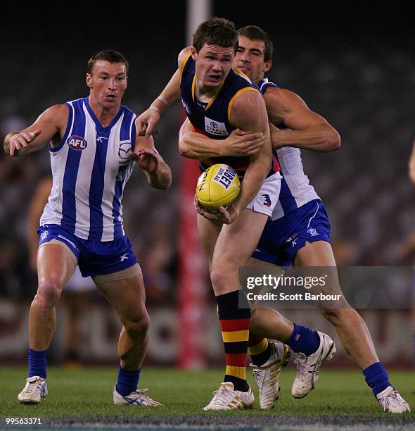 Patrick Dangerfield of the Crows is tackled during the round eight AFL match between the North Melbourne Kangaroos and the Adelaide Crows at Etihad...