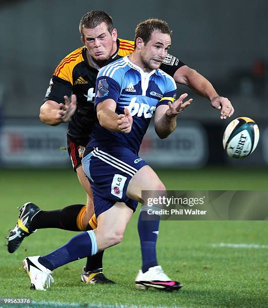 Alby Mathewson of the Blues passes the ball during the round 14 Super 14 match between the Blues and the Chiefs at Eden Park on May 15, 2010 in...