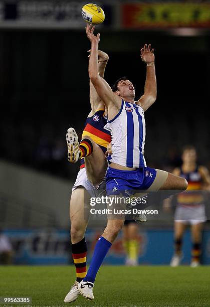 Patrick Dangerfield of the Crows competes for a mark against Todd Goldstein of the Kangaroos during the round eight AFL match between the North...