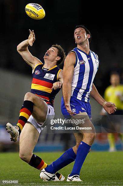 Patrick Dangerfield of the Crows competes for a mark against Todd Goldstein of the Kangaroos during the round eight AFL match between the North...