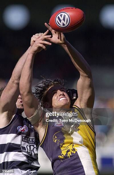 David Mensch for Geelong tackles Michael Gardiner the West Coast Eagles, in the match between the West Coast Eagles and the Geelong Cats, during...