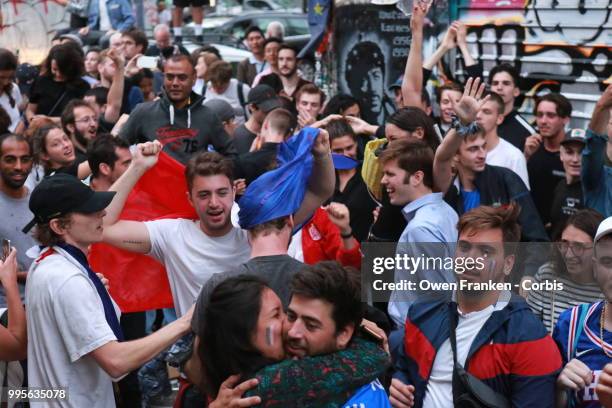 French fans erupt with joy, outside a local bar in the 20th arrondissement, as France wins its semi-final World Cup match against Belgium, on July...