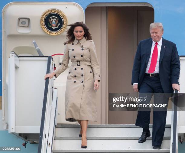 President Donald Trump and US First Lady Melania Trump disembark from Air Force One as they arrive at Melsbroek Air Base in Haachtsesteenweg on July...