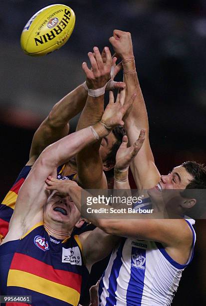 Nathan Grima of the Kangaroos and Patrick Dangerfield of the Crows compete for the ball during the round eight AFL match between the North Melbourne...