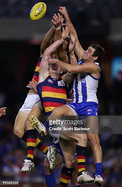 Nathan Grima of the Kangaroos and Patrick Dangerfield of the Crows compete for the ball during the round eight AFL match between the North Melbourne...