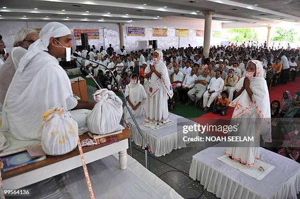 Newly ordained Jain monks, Monica Tated and Manju Tated take part in a "Jain Bhagavati Deeksha Mahostav" ceremony in Hyderabad on May 15, 2010. As...