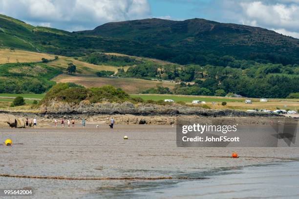 members of the public on a scottish beach - johnfscott stock pictures, royalty-free photos & images