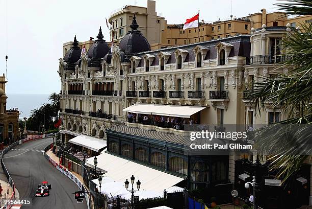 Jenson Button of Great Britain and McLaren Mercedes drives through Casino Square in the final practice session prior to qualifying for the Monaco...
