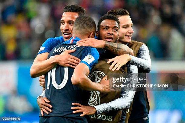 France's midfielder Corentin Tolisso, France's forward Kylian Mbappe, France's forward Thomas Lemar and France's forward Florian Thauvin celebrate at...