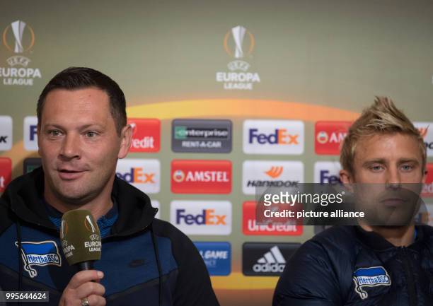 Hertha coach Pal Dardai speaking beside midfielder Per Skjelbred during a press conference ahead of the Europa League football match between...