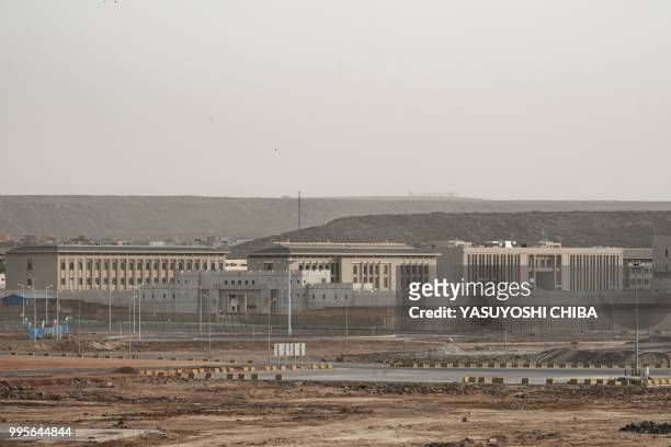 This photograph taken on July 4 shows buildings of a Chinese military base next to Doraleh Multi-Purpose Port in Djibouti. - East Africa's smallest...