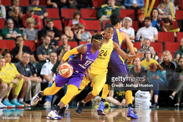 Essence Carson of the Los Angeles Sparks handles the ball against the Seattle Storm on July 10, 2018 at Key Arena in Seattle, Washington. NOTE TO...