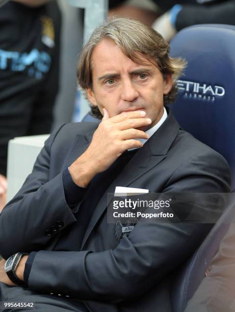 Manchester City manager Roberto Mancini looks on during the Barclays Premier League match between Manchester City and Swansea City at Etihad Stadium...