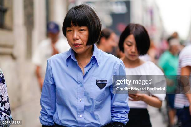 Angelica Cheung, Vogue China Editor in Chief, wears a blue shirt , outside Givenchy, during Paris Fashion Week Haute Couture Fall Winter 2018/2019,...