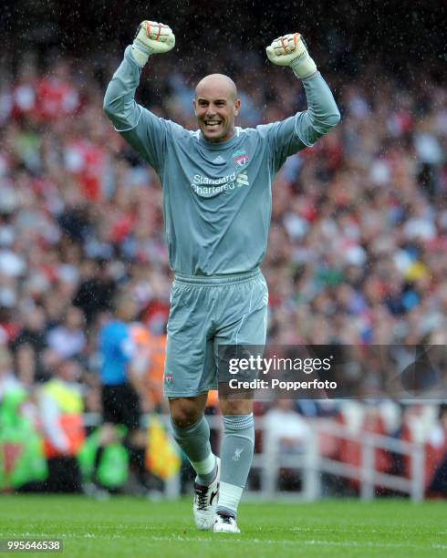 Liverpool goalkeeper Pepe Reina celebrates after Liverpool's 2nd goal during the Barclays Premier League match between Arsenal and Liverpool at the...