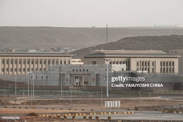 This photograph taken on July 4 shows buildings of a Chinese military base next to Doraleh Multi-Purpose Port in Djibouti. - East Africa's smallest...