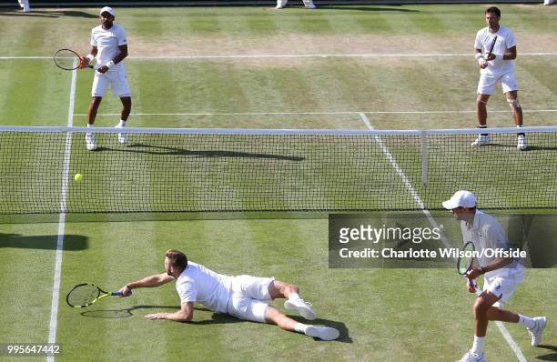 Mens Doubles - Mike Bryan & Jack Sock v Divij Sharan & Artem Sitak - Jack Sock stretches for the ball as he slips and goes down ; Divij Sharan and...