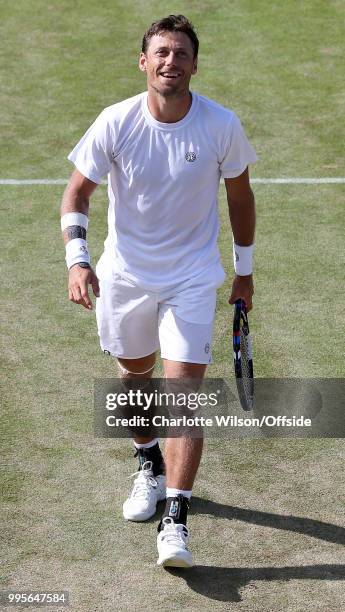 Mens Doubles - Mike Bryan & Jack Sock v Divij Sharan & Artem Sitak - Artem Sitak smiles at All England Lawn Tennis and Croquet Club on July 10, 2018...