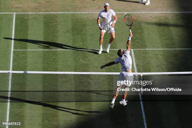 Mens Doubles - Raven Klaasen & Michael Venus v Jamie Murray & Bruno Soares - Bruno Soares jumps up to return the ball to Michael Venus at All England...