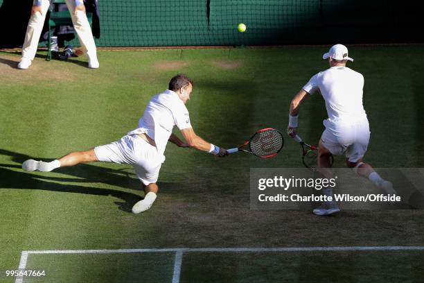 Mens Doubles - Raven Klaasen & Michael Venus v Jamie Murray & Bruno Soares - Bruno Soares slips and falls as he and Jamie Murray lunge for the ball...