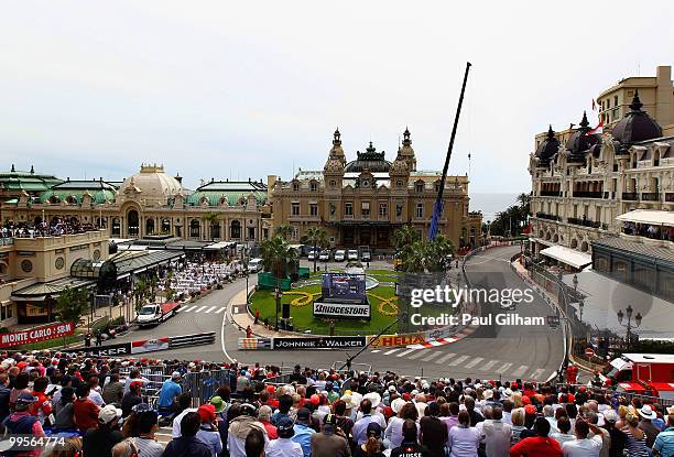 Sebastian Vettel of Germany and Red Bull Racing drives through Casino Square in the final practice session prior to qualifying for the Monaco Formula...