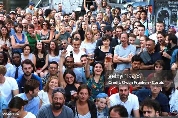 Crowd watches the France v Belgium semi-final World Cup match outside a local bar in the 20th arrondissement, on July 10, 2018 in Paris, France.