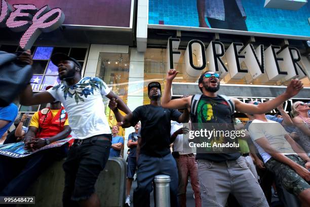 Fans gather for a public viewing event at Times Square to watch 2018 FIFA World Cup Russia Semi Final match between France and Belgium on July 10,...