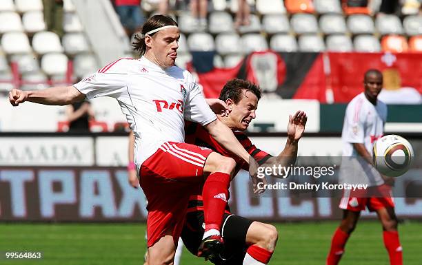 Tomislav Dujmovic of FC Lokomotiv Moscow battles for the ball with Aleksei Pomerko of FC Amkar Perm during the Russian Football League Championship...