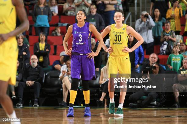 Candace Parker of the Los Angeles Sparks and Breanna Stewart of the Seattle Storm look on during the game on July 10, 2018 at Key Arena in Seattle,...
