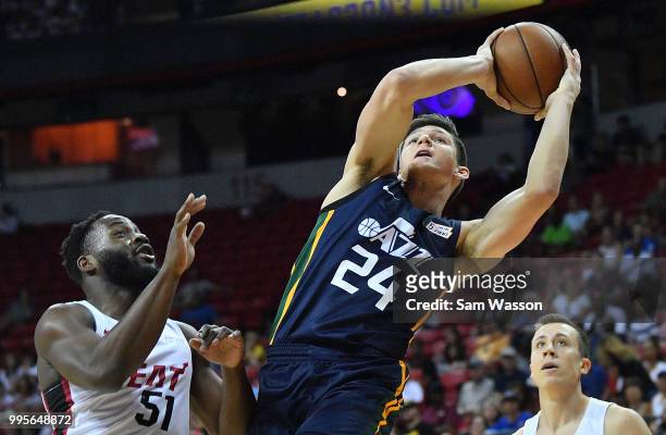 Grayson Allen of the Utah Jazz shoots against Ike Nwamu of the Miami Heat during the 2018 NBA Summer League at the Thomas & Mack Center on July 10,...