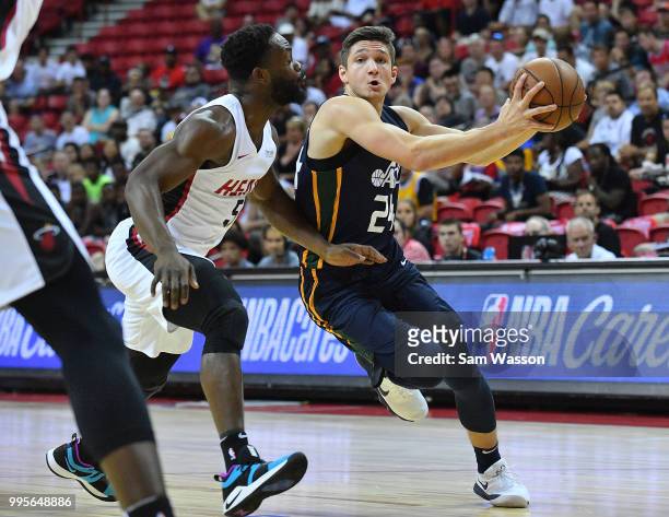 Grayson Allen of the Utah Jazz drives against Ike Nwamu of the Miami Heat during the 2018 NBA Summer League at the Thomas & Mack Center on July 10,...