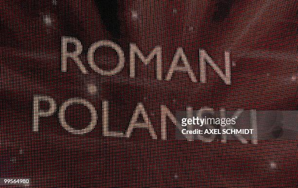 The name of French director of Polish origin Roman Polanski can be seen on a screen during the awards ceremony of the 60th Berlinale Film Festival in...
