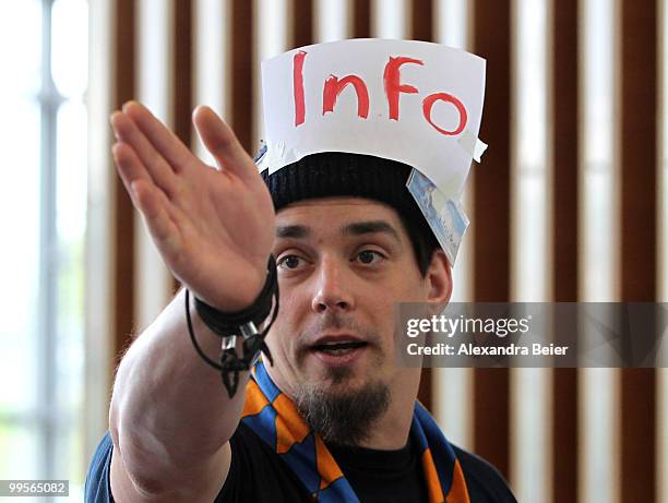 Volunteer Hauke gestures as he helps visitors finding their way at day 4 of the 2nd Ecumenical Church Day on May 15, 2010 in Munich, Germany....