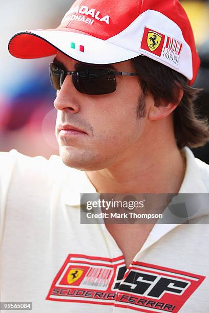 Fernando Alonso of Spain and Ferrari walks in the paddock before the final practice session prior to qualifying for the Monaco Formula One Grand Prix...