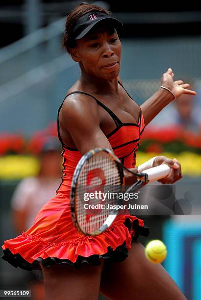 Venus Williams of the USA plays a backhand to Shahar Peer of Israel in their semi-final match during the Mutua Madrilena Madrid Open tennis...