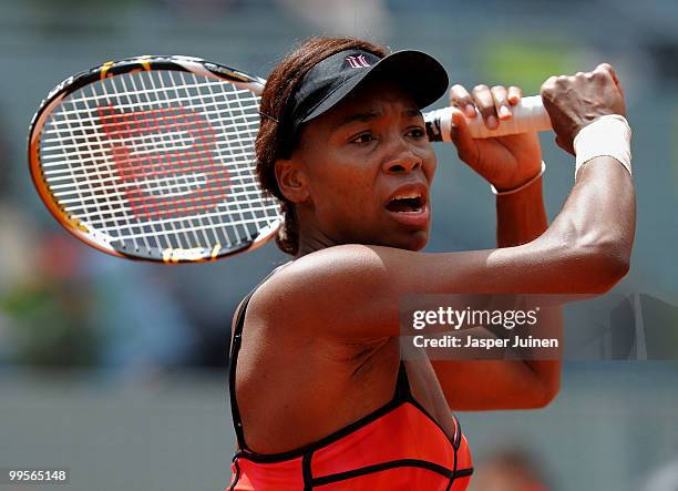 Venus Williams of the USA follows the ball to Shahar Peer of Israel in their semi-final match during the Mutua Madrilena Madrid Open tennis...