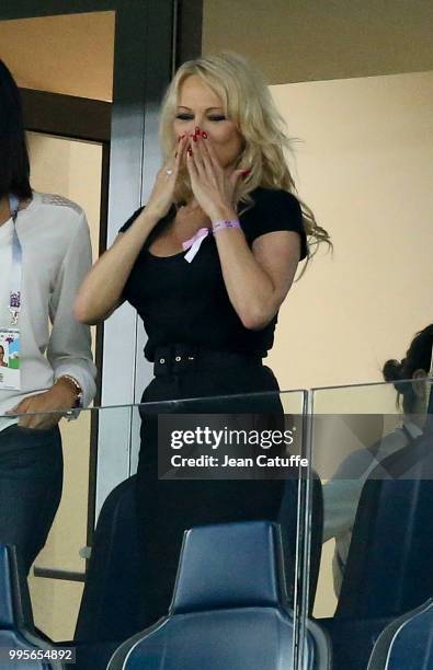 Pamela Anderson sending kisses to boyfriend French player Adil Rami of France following the French victory in the 2018 FIFA World Cup Russia Semi...