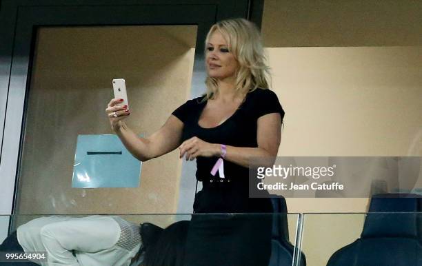 Pamela Anderson, girlfriend of Adil Rami of France celebrates the victory following the 2018 FIFA World Cup Russia Semi Final match between France...