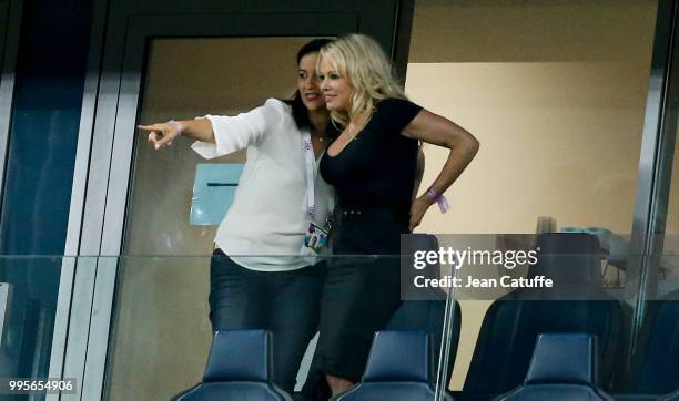 Pamela Anderson, girlfriend of Adil Rami of France celebrates with a friend the victory following the 2018 FIFA World Cup Russia Semi Final match...