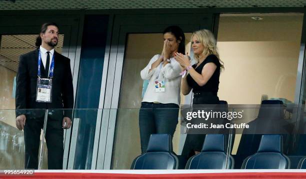 Pamela Anderson, girlfriend of Adil Rami of France celebrates with a friend the victory following the 2018 FIFA World Cup Russia Semi Final match...