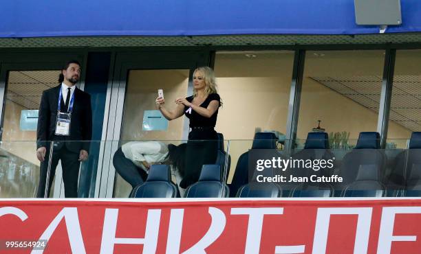 Pamela Anderson, girlfriend of Adil Rami of France celebrates the victory following the 2018 FIFA World Cup Russia Semi Final match between France...